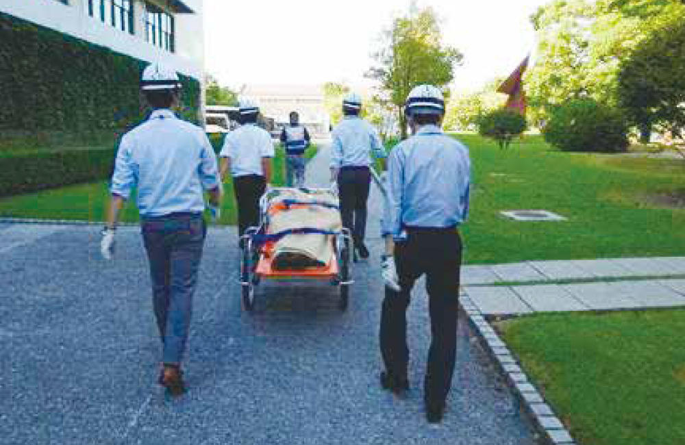 Drill to transport and provide first aid to an injured person